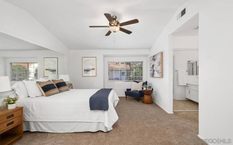 New ceiling fan adorns this large primary bedroom with updated ensuite primary bathroom.