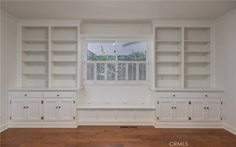 Back bedroom with custom built in cabinets and shelves