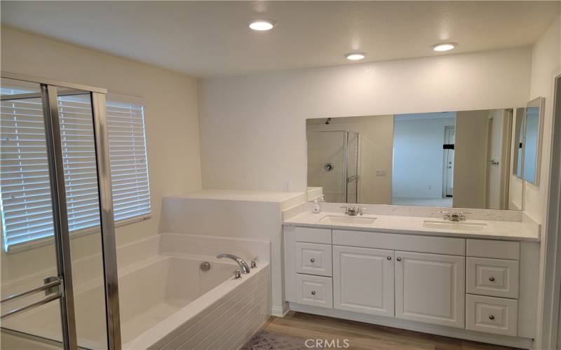 MASTER BATHROOM WITH TUB AND SHOWER