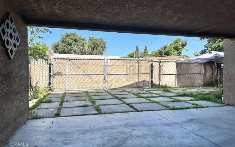 alley access to carport and space for uncovered parking