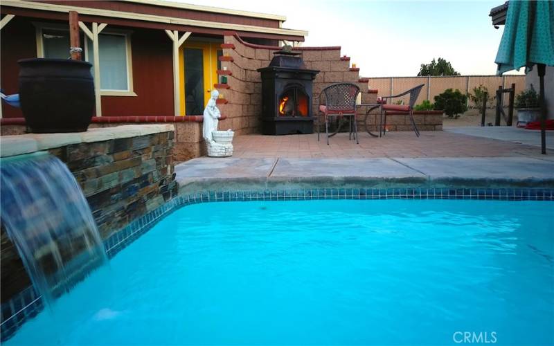 Play in the pool and watch the fireplace at the same time.