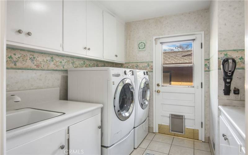 Separate laundry room with access to the back yard.