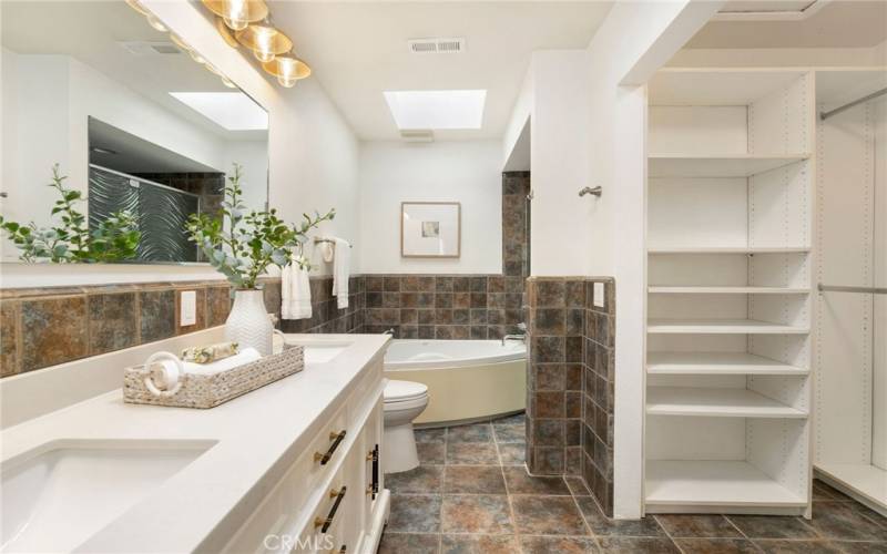 Spacious primary bathroom and closet space.