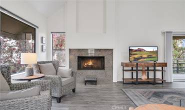 The warmth of a beautiful fireplace and lots of natural light awaits you as you enjoy your large open floor plan.