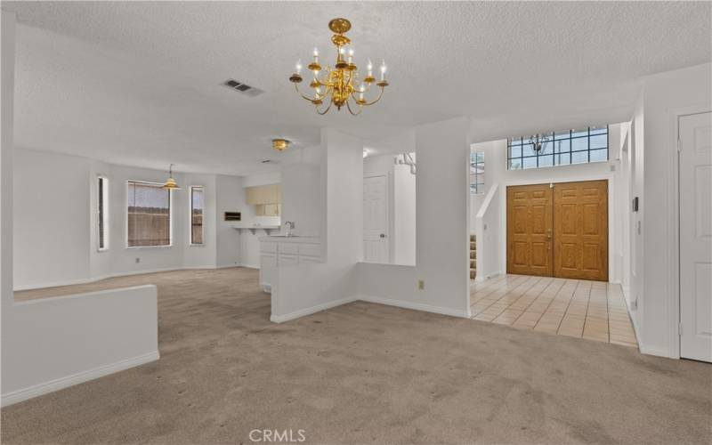 Open floor plan including a Formal Dining room and adjacent Family room.