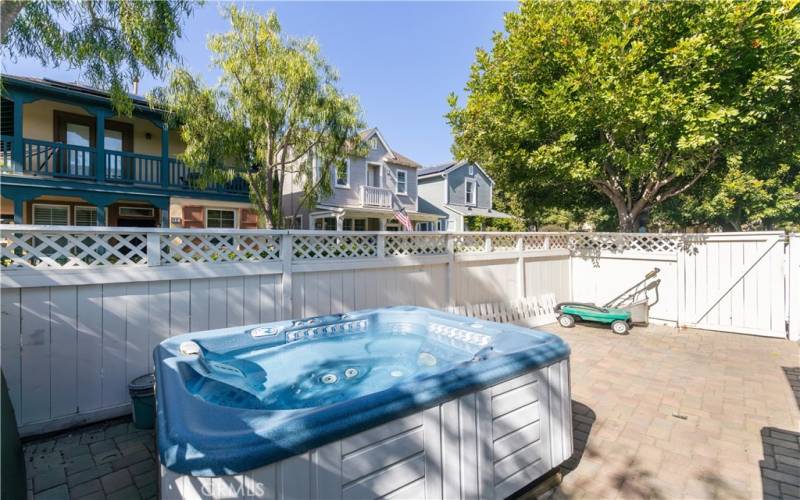 This lot is uniquely designed with a side yard that is larger than many other Surrey Farm homes in the neighborhood. The private yard is gated and has a hot tub and pavers
