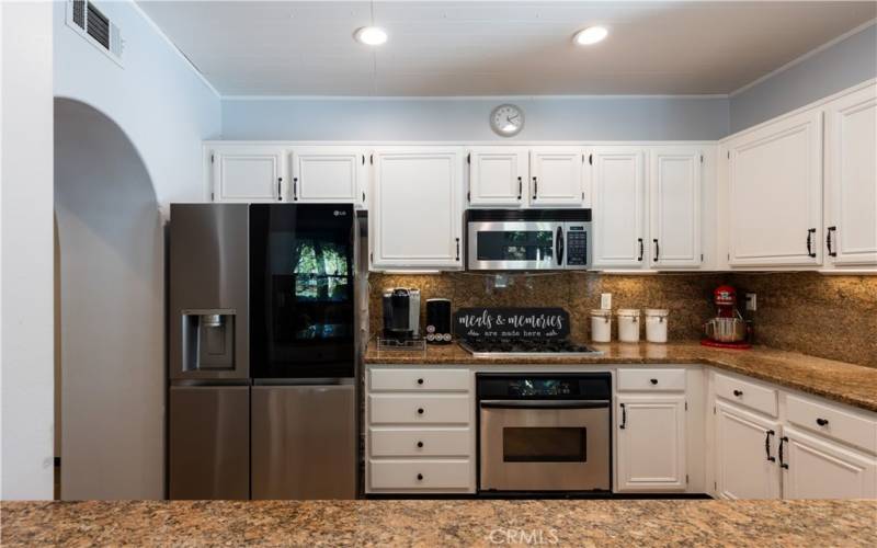 Stainless appliances, granite countertops and under cabinet lighting