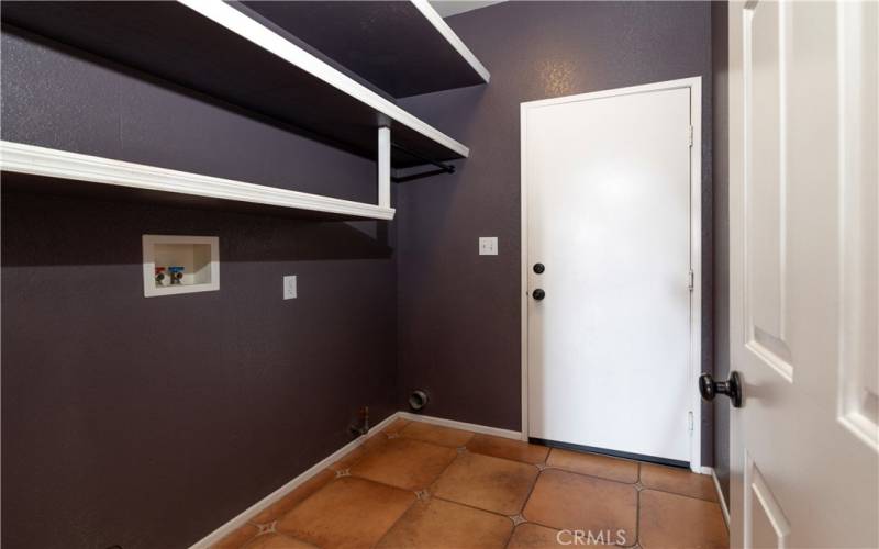 Laundry room leads to 3 car garage.
