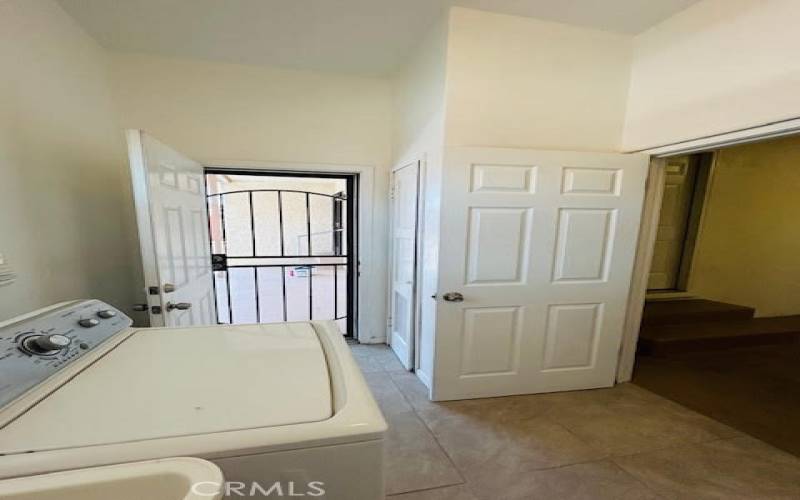 Laundry Room with Security door leading into the backyard.