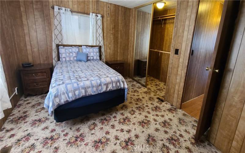 Primary Bedroom with Mirrored Walk-in Closet