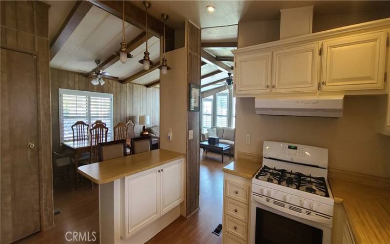 Kitchen/Breakfast Counter Leading to Dining/Living Room