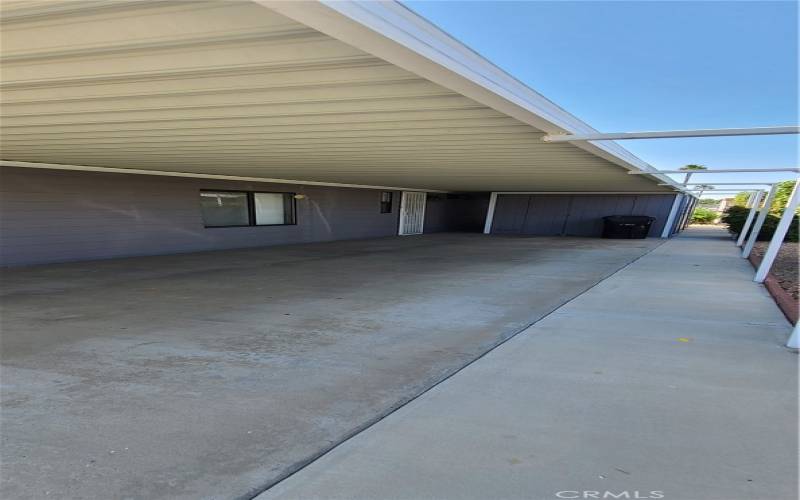 Full-length Covered Carport with Direct Access to Laundry Room