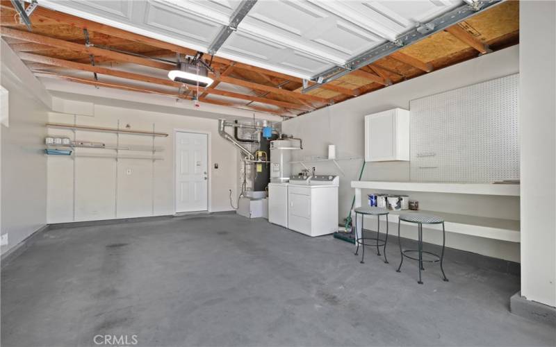 Oversized one car garage leading into kitchen.