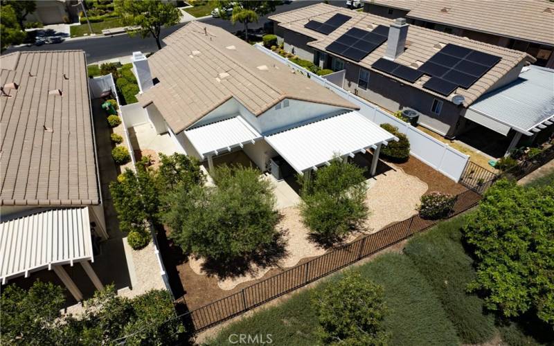 Beautifully manicured rear yard with Alumawood type covered patios and NEW VINYL FENCING