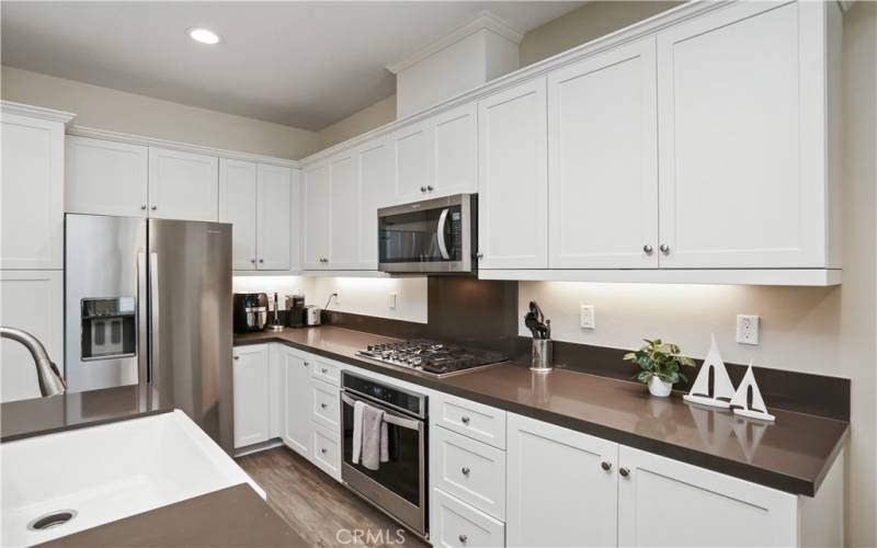 Kitchen is complete with a built in microwave, range, plenty of countertop and cabinet space.