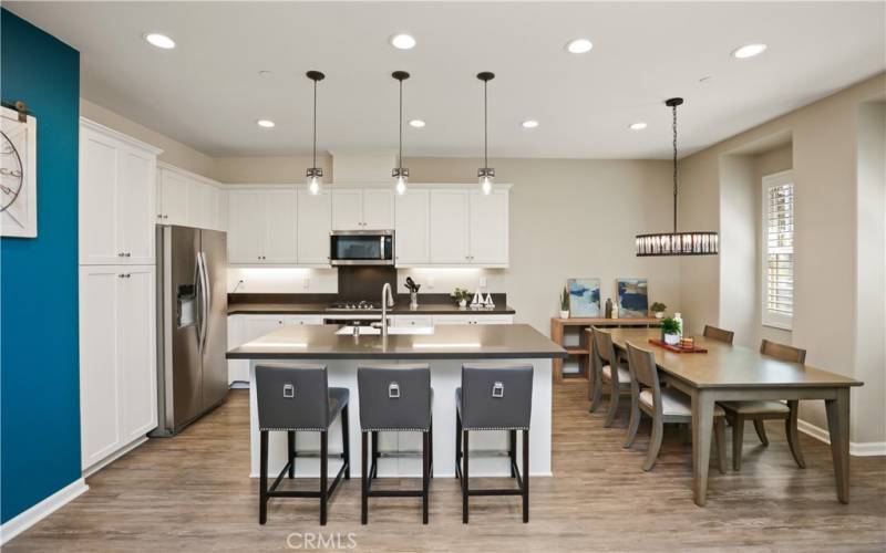 Open concept kitchen and dining space, providing many options for seating, entertaining and dining.
