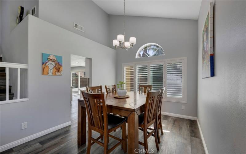 DINING ROOM, OFF KITCHEN, WITH EXPANSIVE CEILINGS.