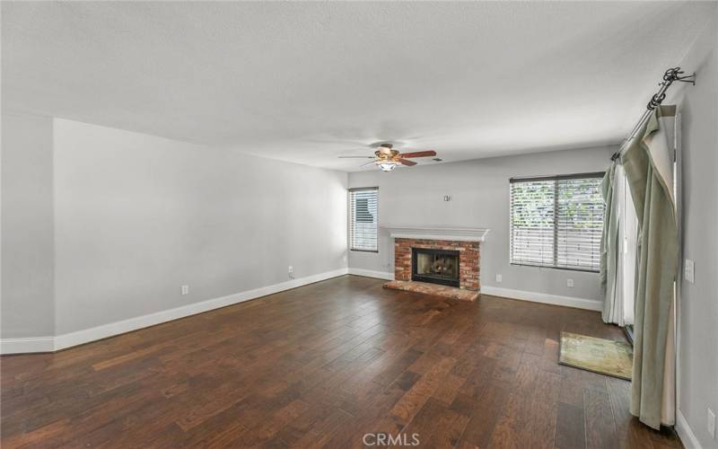 upgraded flooring and baseboards in ample size family room