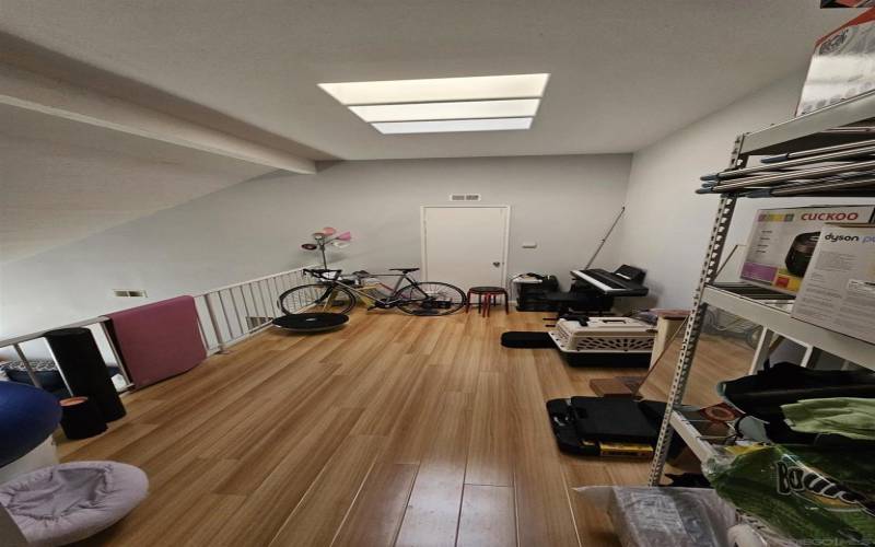 Spacious loft can be used as a 3rd/guest bedroom, or just storage!  Complete with a skylight!