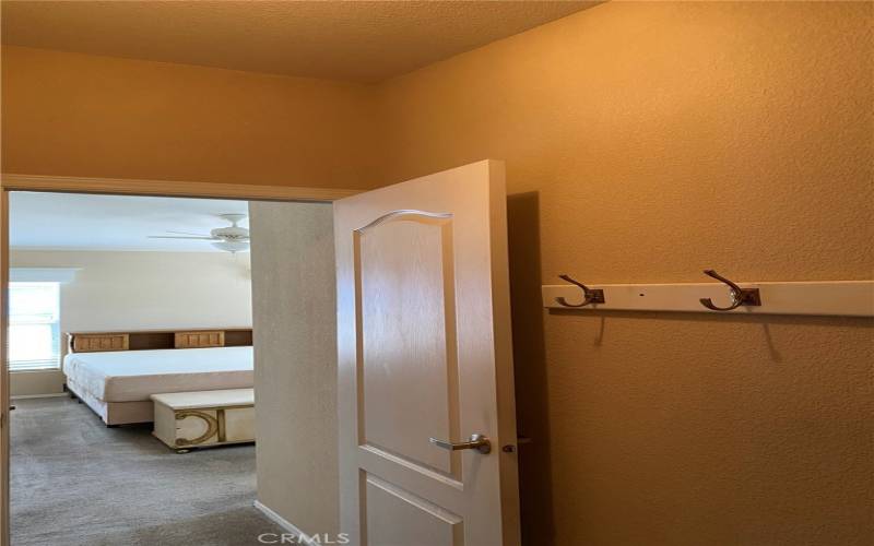 Master Walk in closet looking out towards bedroom.