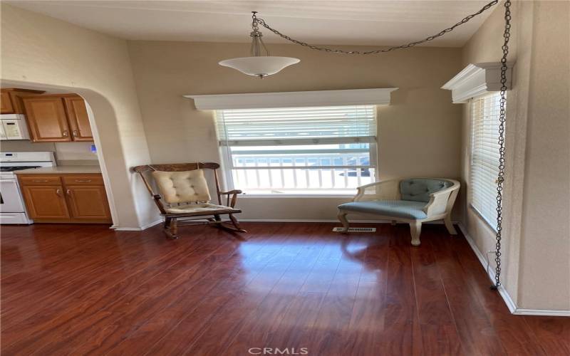 Sitting area between Kitchen and living room. The window is the front patio open for a nice breeze.