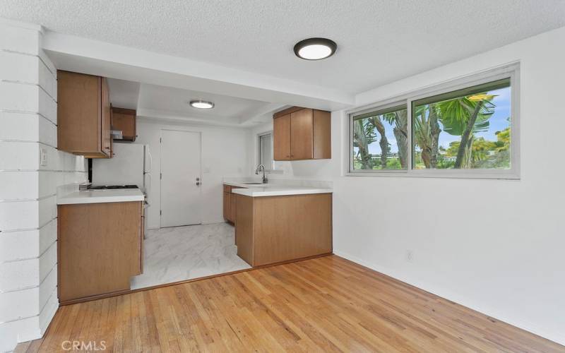 Your dining area has wood floor and is adjacent to the kitchen.
