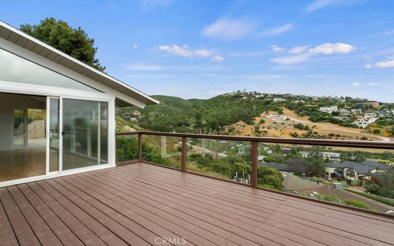The deck has direct access to the great room....and views the hills in addition to the ocean!