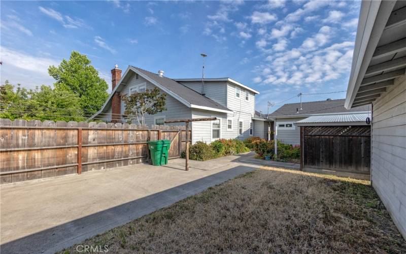 backyard between 2nd garage and house - move the fence forward for larger backyard