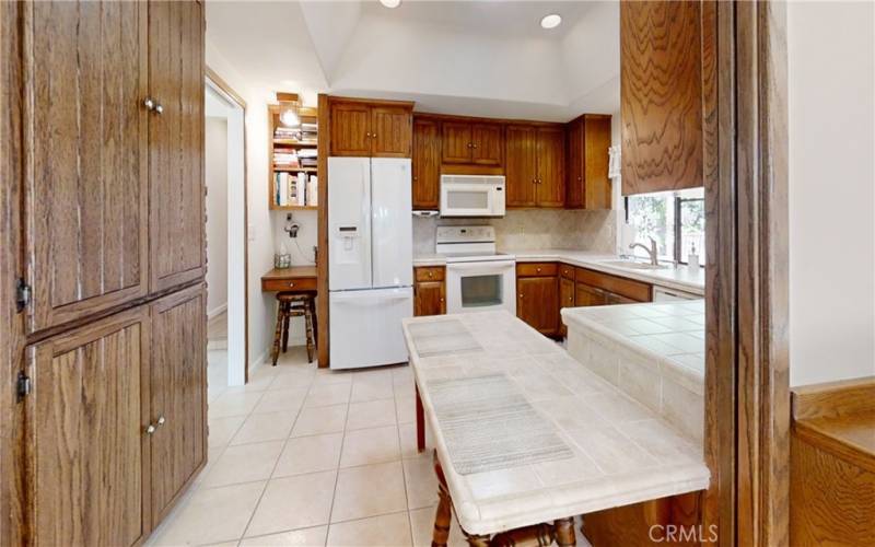 Kitchen with island for that casual dining. Looking nook for work area.