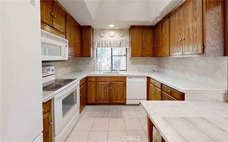 Large kitchen looking out to back deck