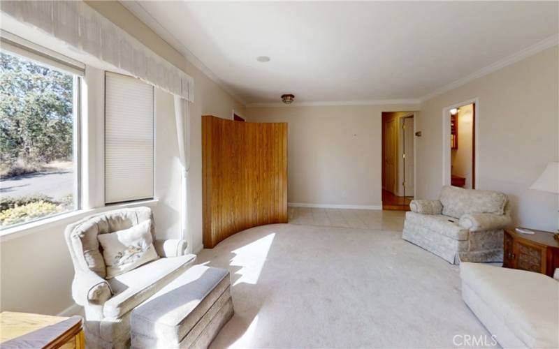 Large living room with gas fireplace and nice picture windows.