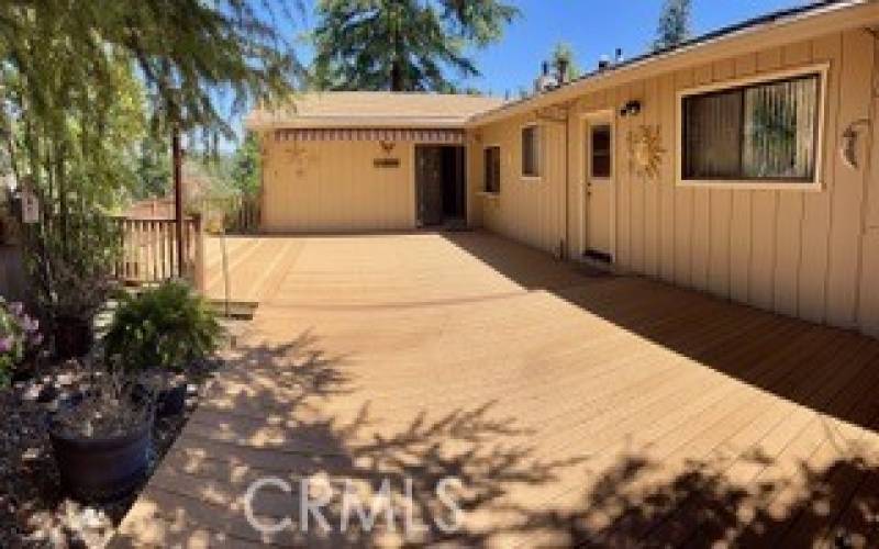 Back deck off great room leads to garage on backside and separate workshop