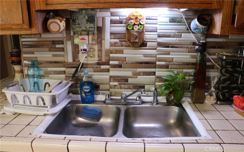 kitchen sink with upgraded backsplash