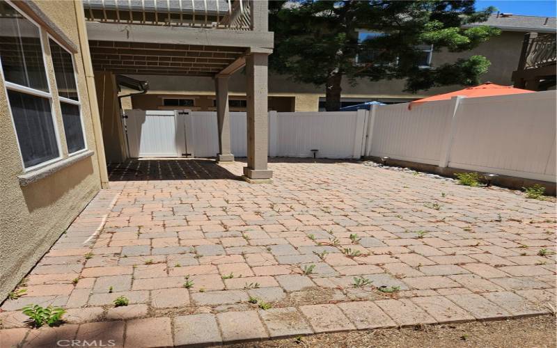 Pavers and vinyl fencing for privacy and security.