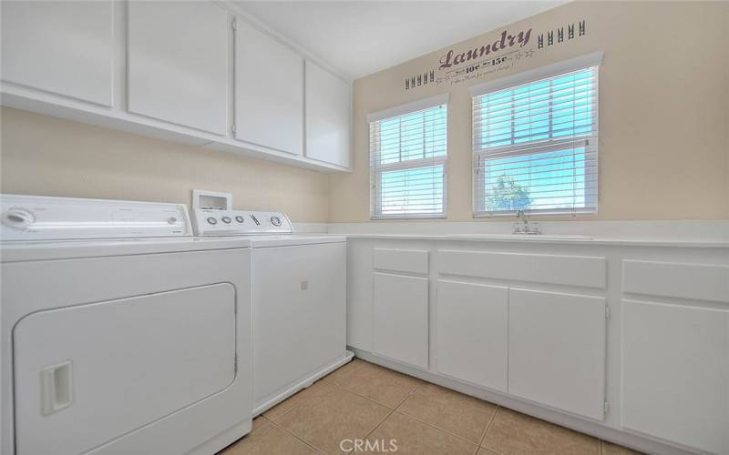 Big Spacious Laundry Room with Plenty of Storage and Sink