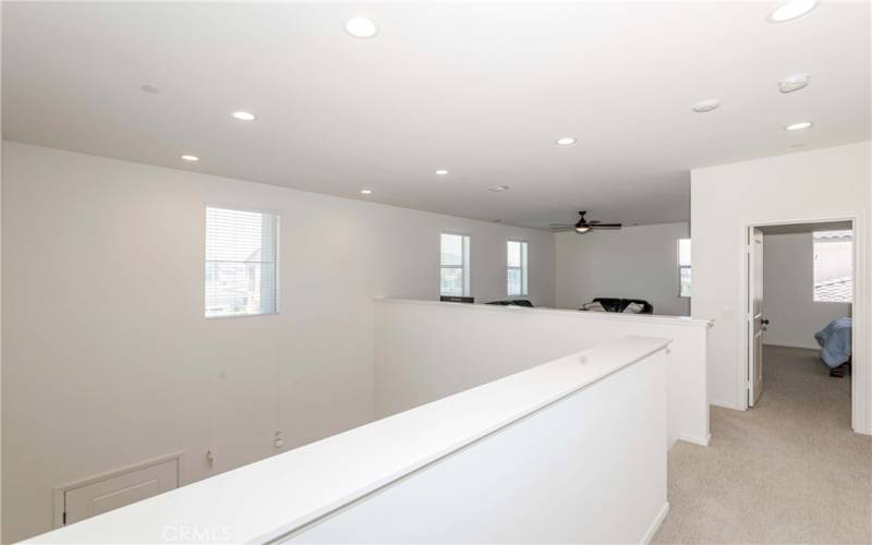 Upstairs hallway to loft and a bedroom