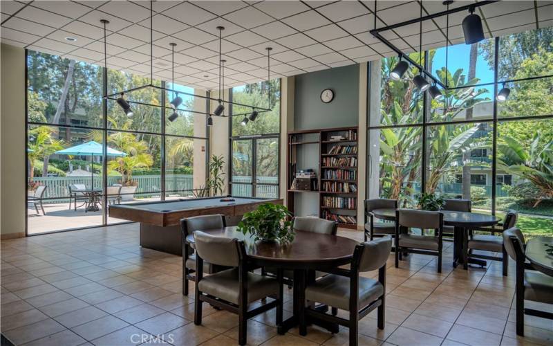 Clubhouse with pool table and sitting areas.