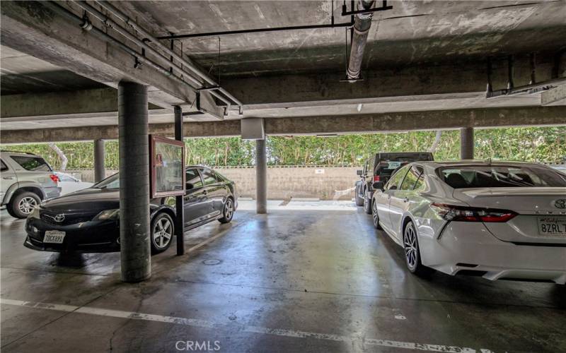 Two tandem parking spaces are conveniently located near elevator and unit.