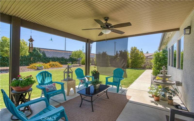 Patio features a fan and retractable shade