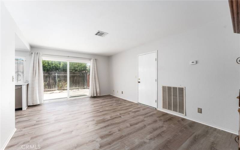 Beautiful vinyl plank flooring in the family room that is off the kitchen so the chef is still part of the conversation.