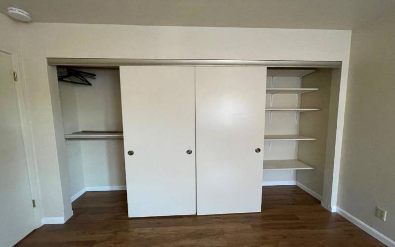Master Bedroom has spacious closet  for two adults. Note that the hardwood floor continues in closet