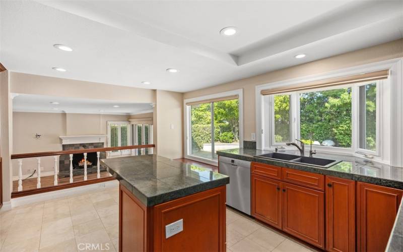 Spacious remodeled kitchen with large double pane windows.