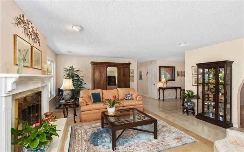 Pass through the living room to hallway -All rooms on opposite side of entertaining area.