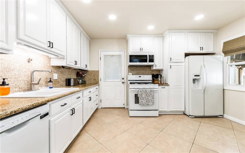 Spacious kitchen with newly painted cabinetry & hardware