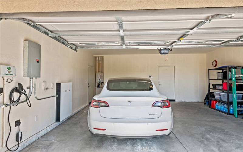 2-car finished garage with charging station. Tesla Powerwall. Tankless water heater.