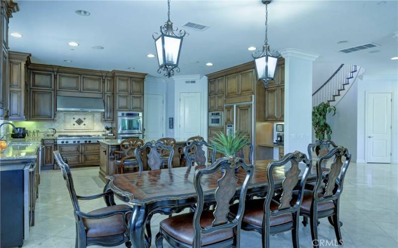 Casual dining area with drop down lighting.