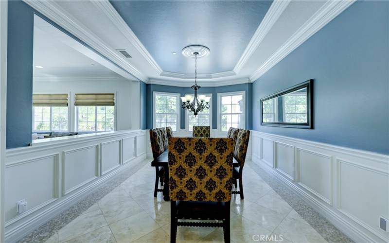 Wainscoting along each wall in the formal dining room.
