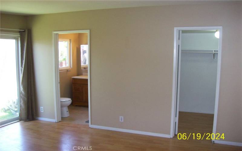 View Of Primary Bathroom And Walk-In Closet