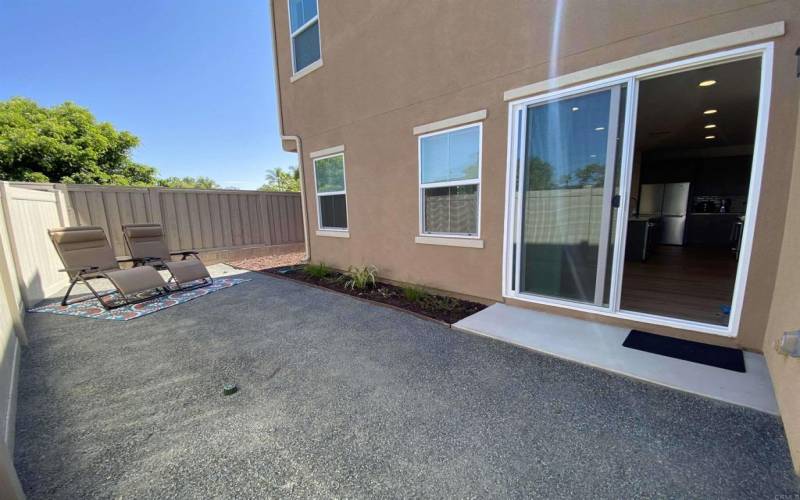 This home has a back patio and a side yard.