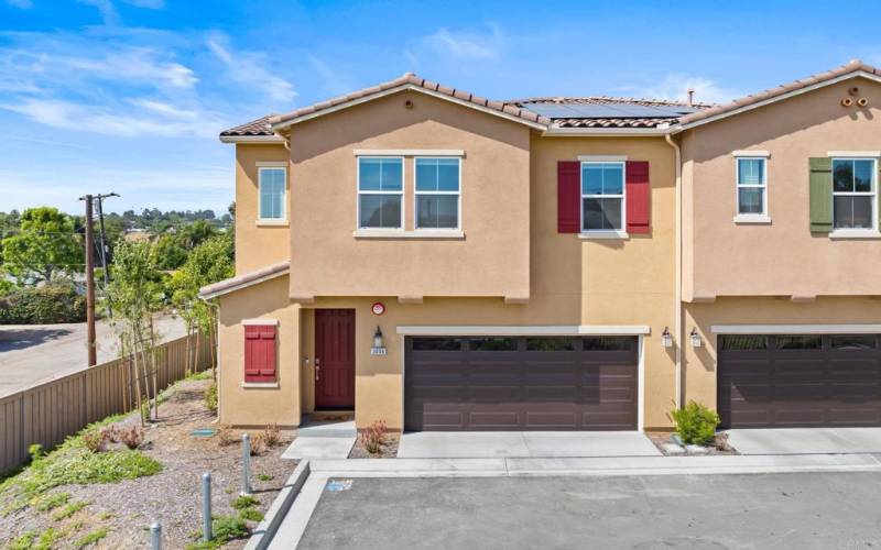 Front exterior of this almost new townhome on premium corner lot with larger yard.